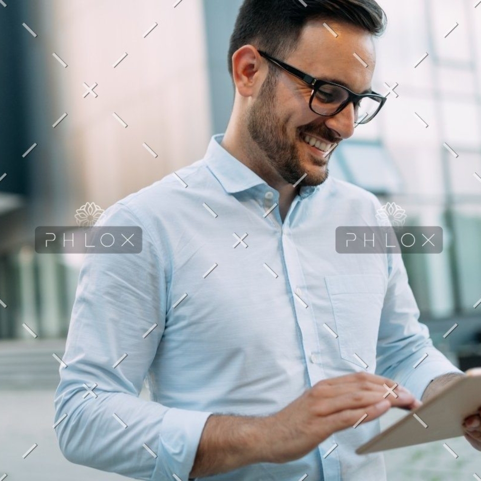 demo attachment 815 portrait of businessman in glasses holding tablet awvhcju